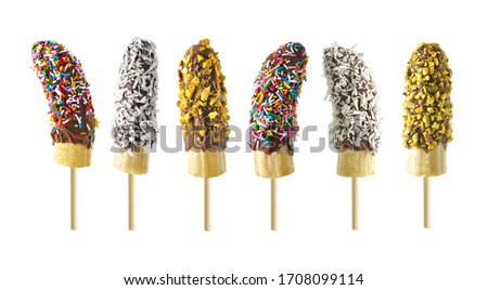 Frozen chocolate dipped banana pops with an assortment of sprinkles, nuts and coconut isolated on a white background Royalty-Free Stock Photo #1708099114