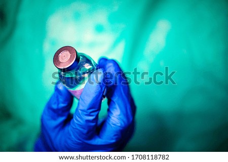 Closeup of a doctor with a bottle of vaccine. Coronavirus Covid-19 Protection and Vaccination