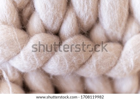 Merino wool. Knitted fabric background close up