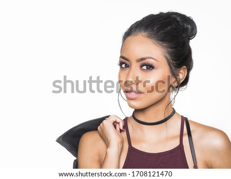 Beautiful woman with sultry makeup and hair pulled back isolated against white background Royalty-Free Stock Photo #1708121470