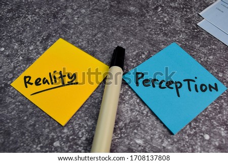 Perception or Reality write on a sticky note isolated on the table. Royalty-Free Stock Photo #1708137808