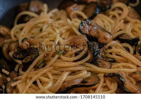 Spaghetti Pasta Close Up Picture with Shrimps and Zucchini Food Concept