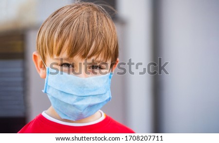 Boy in a surgical bandage. Coronavirus, illness, infection, quarantine, medical mask, COVID-19. Boy in a medical mask. Quarantine and protection virus, flu, epidemic COVID-19. Coronavirus quarantine. Royalty-Free Stock Photo #1708207711