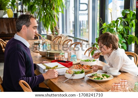 Family of two enjoying time together in a cafe