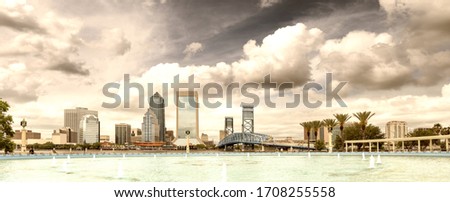 Jacksonville, Florida. Panoramic view of city downtown and brigde at dusk, USA.