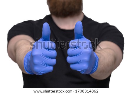 Person with blue latex gloves for protection coronavirus with thumbs up, Covid-19 self isolation or quarantine at home support doctors and nurses virus