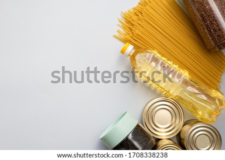 Cereals, various products, canned food, pasta and soap with place for text. Humanitarian assistance during the coronavirus pandemic. Stock of non-perishable food items Royalty-Free Stock Photo #1708338238
