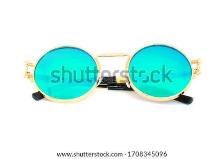 Multi-colored sunglasses on white background. Cool chameleon glasses. Useful summer acssessory for daily wearing. Good sun protection. 