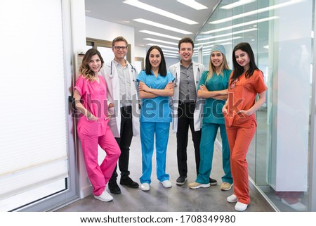 Portrait of young medical professionals at hospital 