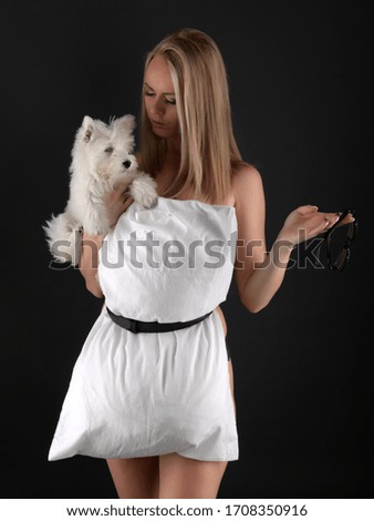 Young woman with West Highland White Terrier