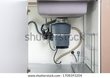 Garbage Disposal under the modern sink, waste chopper concept Royalty-Free Stock Photo #1708393204
