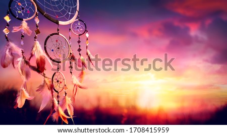 Dreamcatcher - Native American Decoration At Sunset Royalty-Free Stock Photo #1708415959