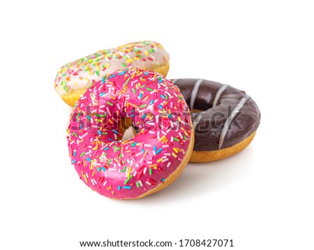 Donuts with strawberry, chocolate and vanilla icing and multicolored sprinkles, isolated on a white background