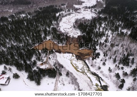 Aerial view of a natural dam in the woods of the Canadian shield.d