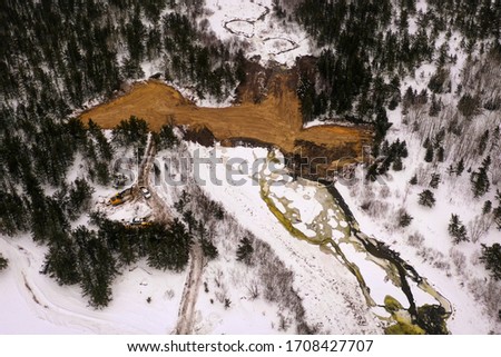 Aerial view of a natural dam in the woods of the Canadian shield.d