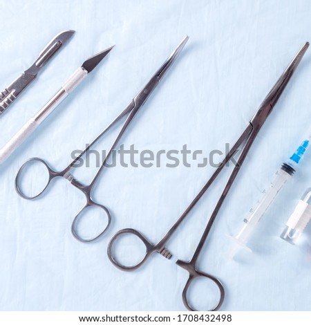 Surgical instruments on the bluen fabric in the operating room