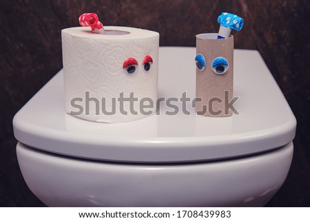 A couple of men and women in the form of toilet paper and a sleeve on a love date, a funny concept