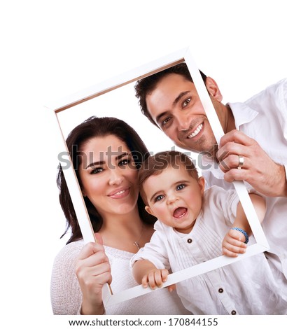 Happy family portrait isolated on white background, holding in hands frame, nice picture of adorable baby girl with parents