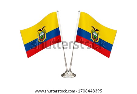 Ecuador table flag isolated on white ground. Two flag poles with flags and Ecuador flag on the table.