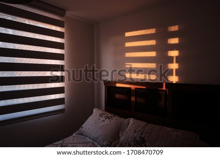 Sunrise coming through a bedroom window