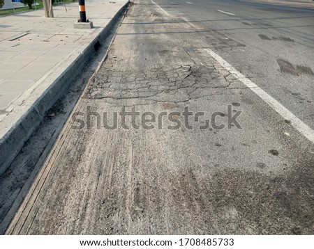 Damaged cracks in the road Dangerous for traffic