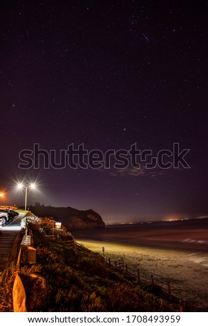 Long exposure of night sky over the beach