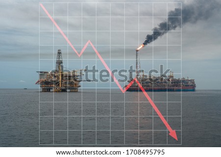 Concept of falling market in oil marine industry with with downward graphics. Oil price decreases. FPSO tanker vessel and Oil Rig platform.