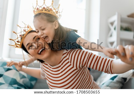 Happy loving family. Mother and her daughter child girl playing and hugging at home. Royalty-Free Stock Photo #1708503655