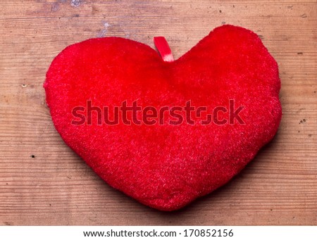 big heart shape on grunge wooden background with copy space 