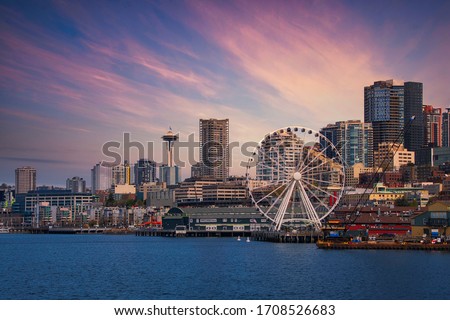 DOWNTOWN SEATTLE SKYLINE WITH THE GREAT WHEEL AND WATER FRONT