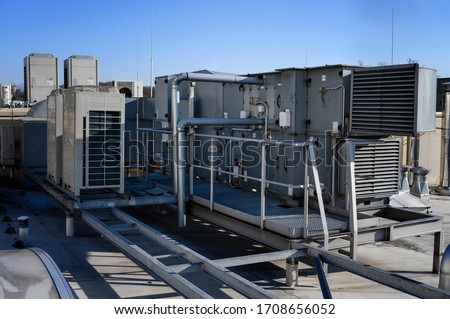 Large air handling unit on the roof. Royalty-Free Stock Photo #1708656052