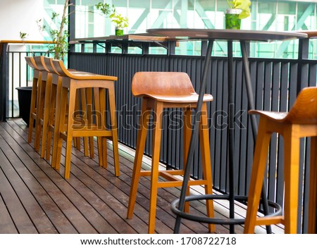 Table and chair on the terrace with wooden floor background