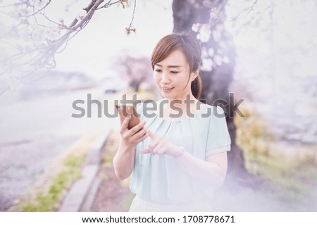 A cherry tree and Asian woman