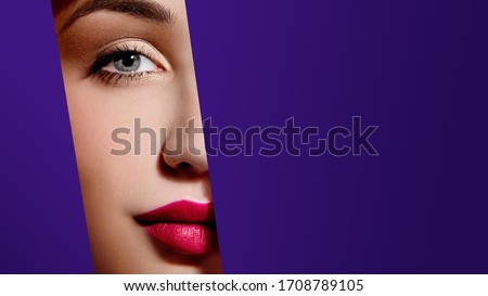 Woman face with plump red lips in violet paper frame. Young model. Close up beauty photo. Geometry and minimalism. Creative fashion makeup, beautiful woman, clear skin Royalty-Free Stock Photo #1708789105