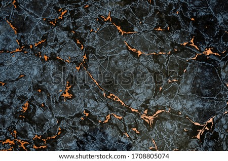 Abstract black and gray background with orange accents. Randomly located pattern. Dark background for various tasks. Selective focus.