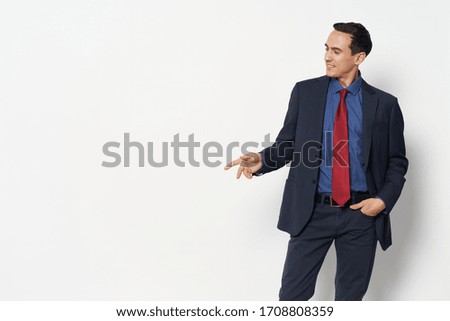 Man red tie blue shirt trousers jacket
