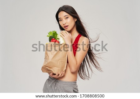 Isolated background pack of products beautiful Asian woman