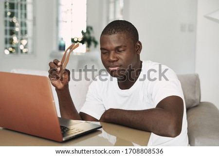African appearance laptop guy dark skin