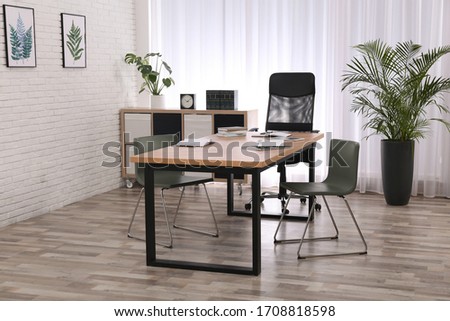 Director's office with large wooden table. Interior design Royalty-Free Stock Photo #1708818598