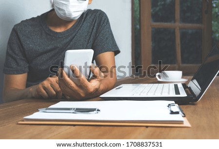 Business man working with computer laptop on wooden table at home. Working online business concept.