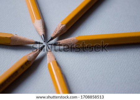 Slate pencils on a gray background