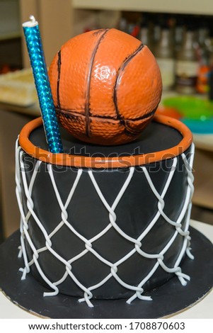 Basketball on birthday cake close up