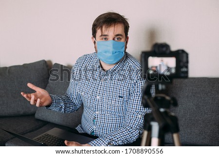 Portrait of blogger man recording video at home online influencer vlogger social media live streaming concept