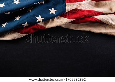 Happy Memorial Day. American flags with the text REMEMBER & HONOR against a blackboard background. May 25.