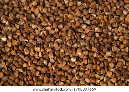 Buckwheat loose product to porridge and side dish. Loose buckwheat background. buckwheat texture