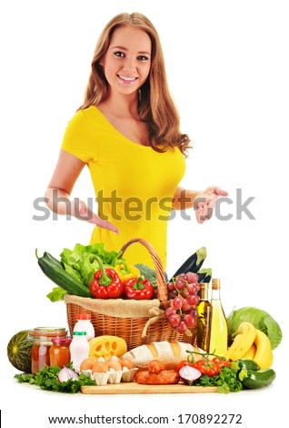 Young woman with assorted grocery products isolated on white background
