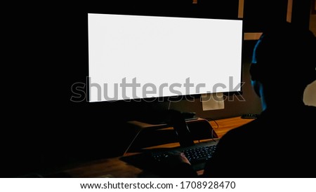 Man working on computer at the desk. computer screen mockup
