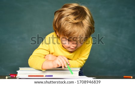 School and education concept. Schoolkid or preschooler learn. School or college pupil showing parents a test with good grade