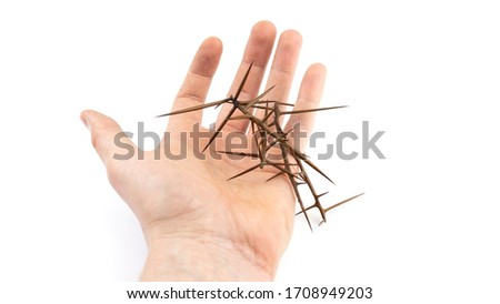 Hand with big spikes on a white isolated background.