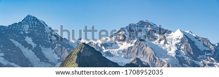 Switzerland, Panoramic view on Eiger, Monch and Jungfraujoch and green Alps around Royalty-Free Stock Photo #1708952035